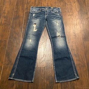 Silver Women’s distressed jeans. Size 32x33.